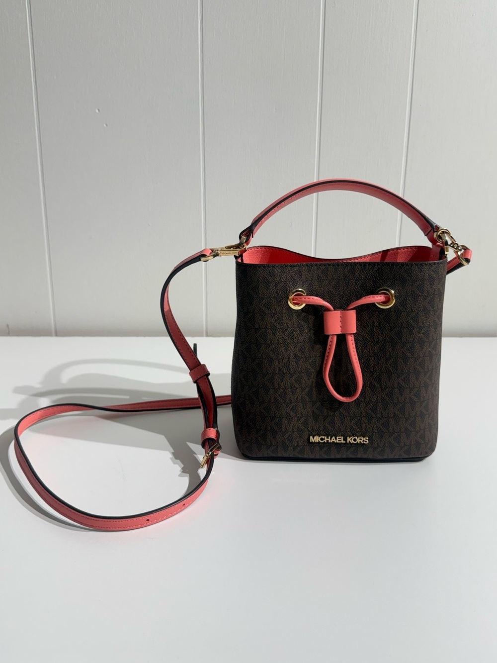 Michael Kors Brown Monogram Bucket Bag with coral Trim